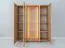 Vetrinetta "Loir" 04, rovere massello, oliato, finitura naturale, piano in travertino, 3 ante, 12 scomparti, illuminazione a LED, 120 x 41 x 140 cm