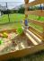 Spielturm inkl. Wellenrutsche aus Holz Natur Detailansicht Sandkasten
